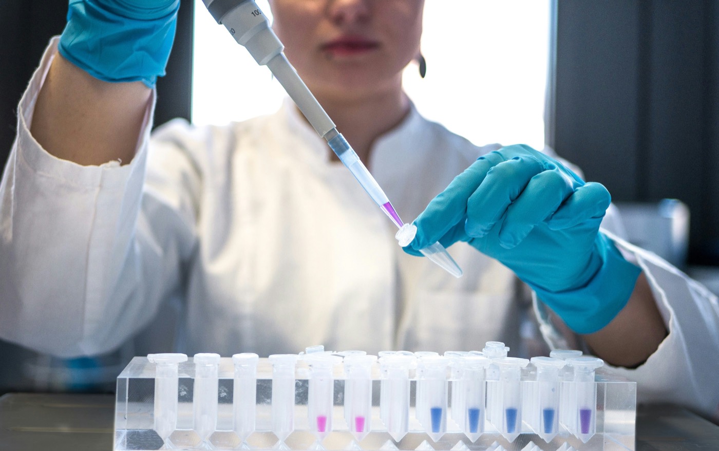 Scientist pipetting a sample for analytical testing